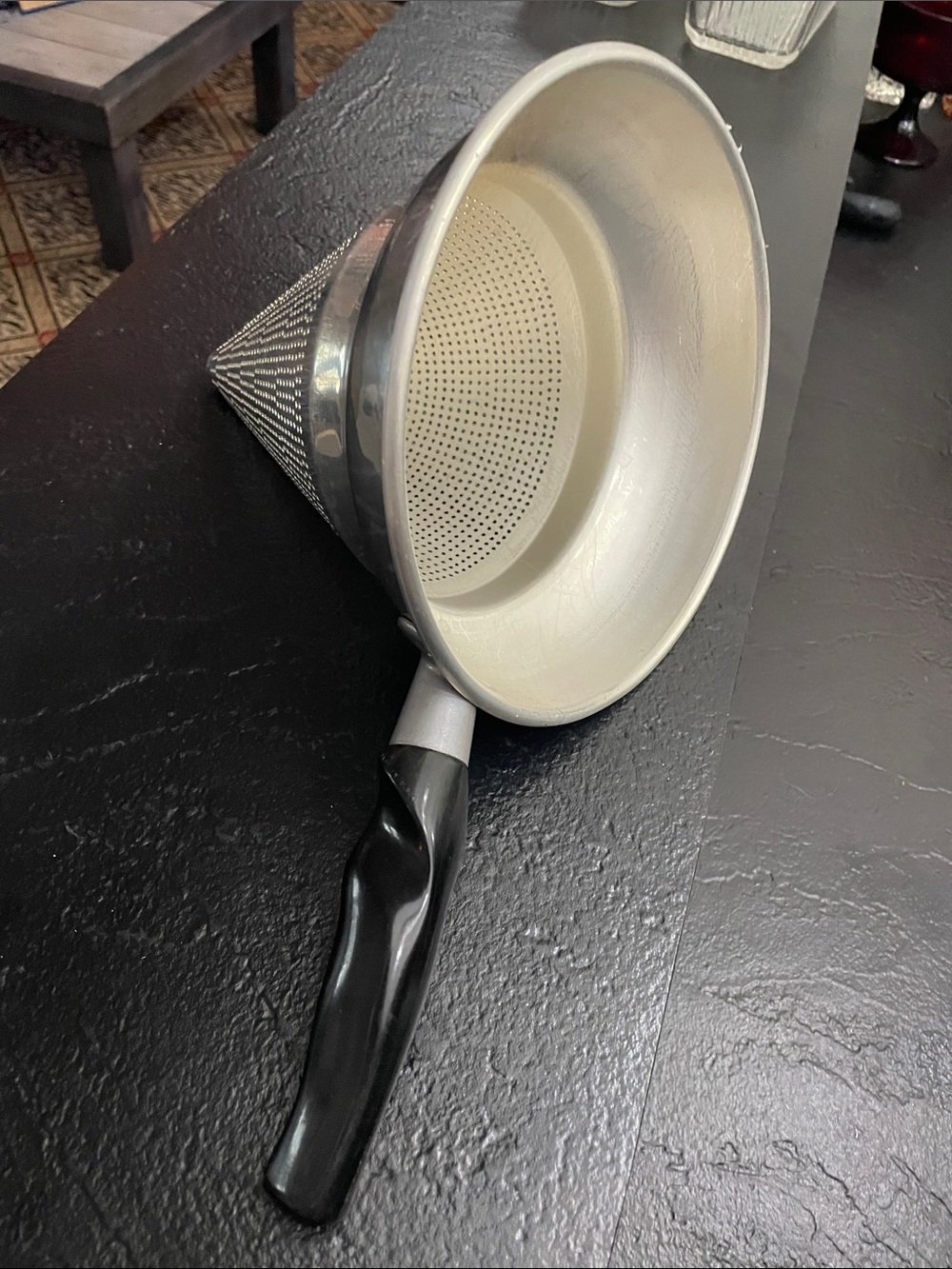 Black and Silver Handheld Food Strainer with Built-In Mesh Cone